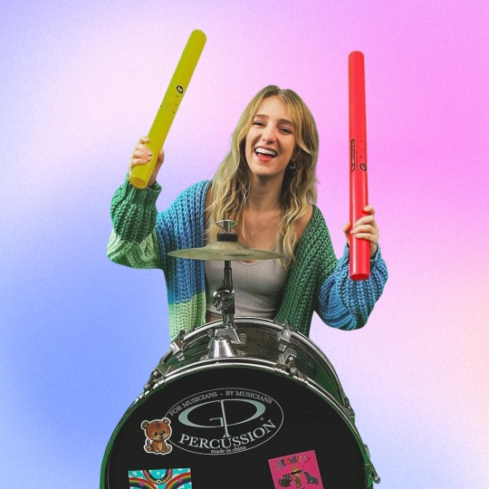 Autumn is playing drums with boomwackers